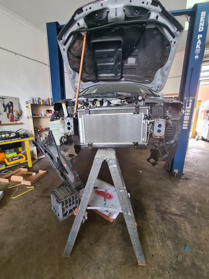 Vehicle undergoing front-end air-conditioning repair in the Autochill workshop