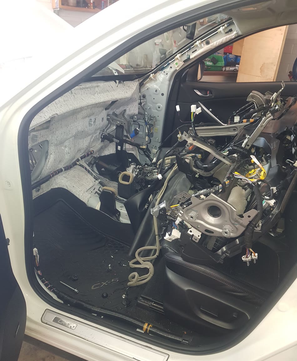 Vehicle dashboard removed for access to internal climate-control components